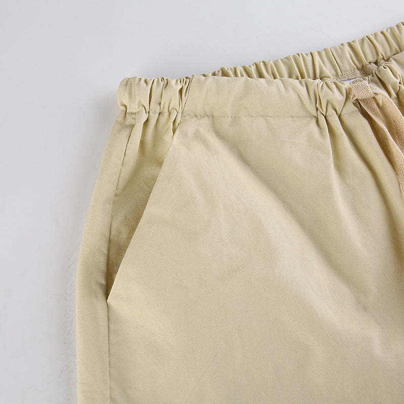 Sleek Casual Asymmetrical Pocket Drawstring Closure Woven Pants